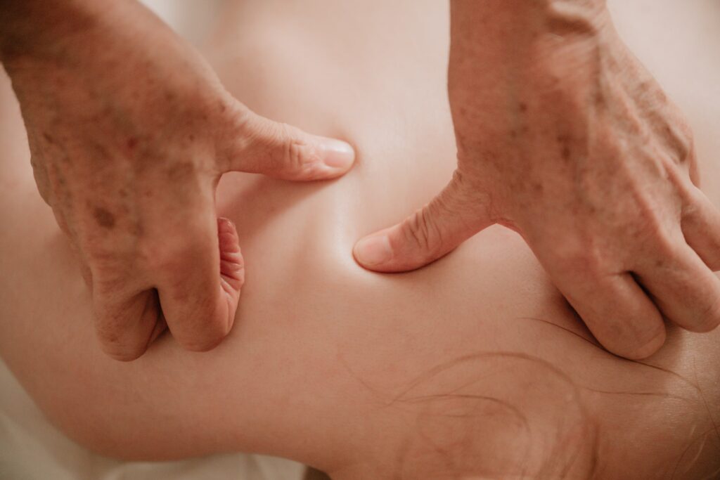 Specific thumb massage technique during Sound Healing and Massage in Luang Prabang