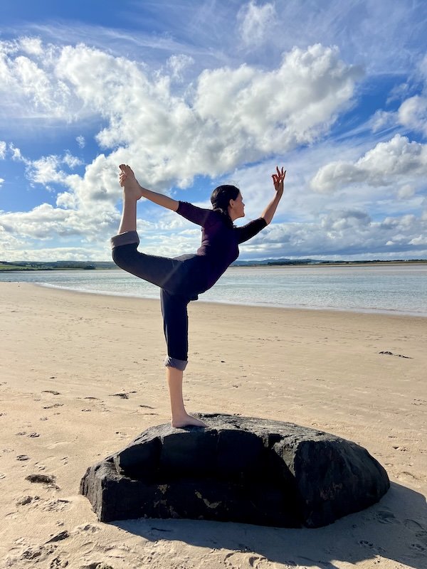 Surya Bee - Deborah Hill in Dancer Pose on Northumberland beach